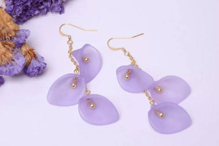 DIY dangling earrings made using cone beads to represent delicate Calla flowers