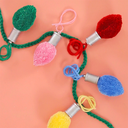 DIY Christmas light pom pom garland