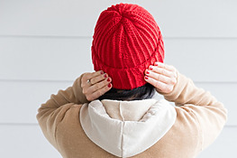 Woman Wearing a Classic Ribbed Crochet Beanie