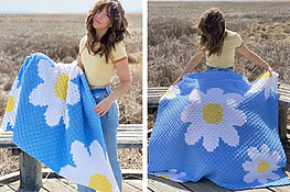 blue crochet throw blanket featuring large daisy flowers