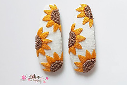 hand embroidered hair clips with small sunflowers