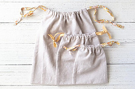 DIY linen drawstring bag with French seams and bias tape ties