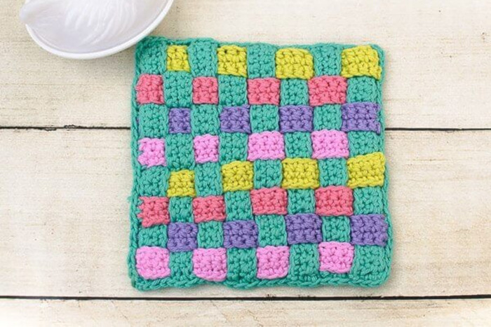 DIY square crochet potholder with colorful yarn scraps