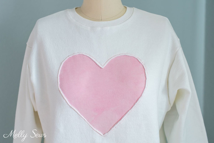 add cute reverse applique heart to a fleece sweatshirt