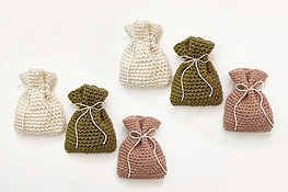 small crochet pouches on white background