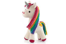 DIY crochet unicorn amigurumi with white body and rainbow colored mane and tail