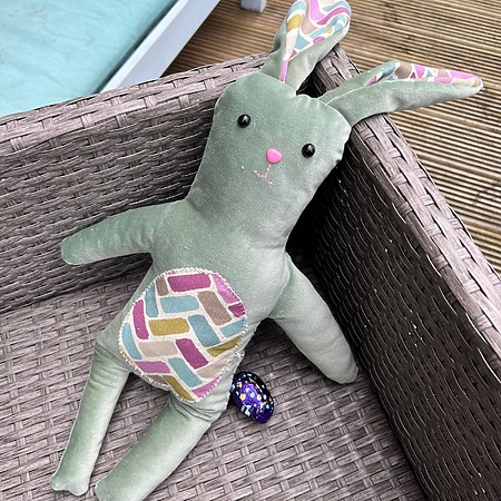 Upcycle My Stuff Bunny: A large, textured fabric bunny made from upcycled materials with very long floppy ears