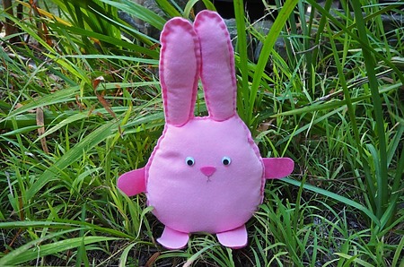 Sew A Softie Bunny: A simple, round felt bunny with visible hand-sewn running stitches around the edge