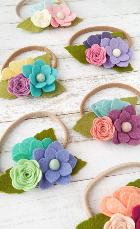 Felt Flower Headband: A soft elastic headband for children featuring a trio of colorful handcrafted felt blossoms
