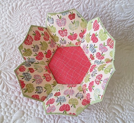 Hexagonal Fabric Bowl: A structured six-sided fabric bowl made from colorful patterned cotton, sitting on a table