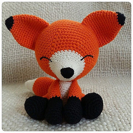 The Sleepy Fox: A peaceful, sleeping crocheted amigurumi fox with closed embroidered eyes and soft yarn details