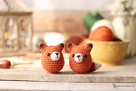 Crochet Fox Egg: A small, egg-shaped crocheted fox plushie with embroidered facial details
