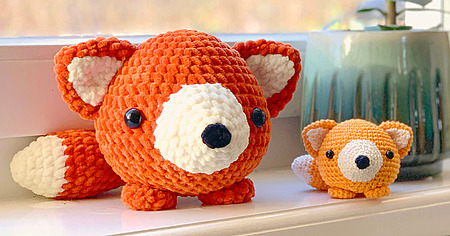 Axl the Fox: A tiny, three-inch crocheted amigurumi fox sitting upright, perfect for a desk accessory or keychain