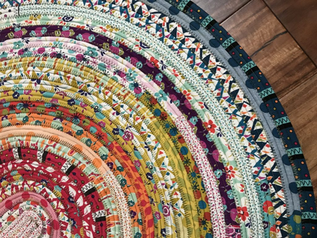 Free jelly roll rug sewing tutorial - Easy DIY scrap fabric floor mat by Create Whimsy